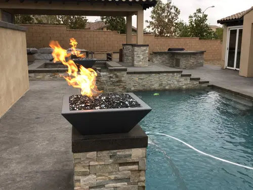 Backyard fire pit with glowing flames, surrounded by cozy outdoor furniture on a patio at dusk